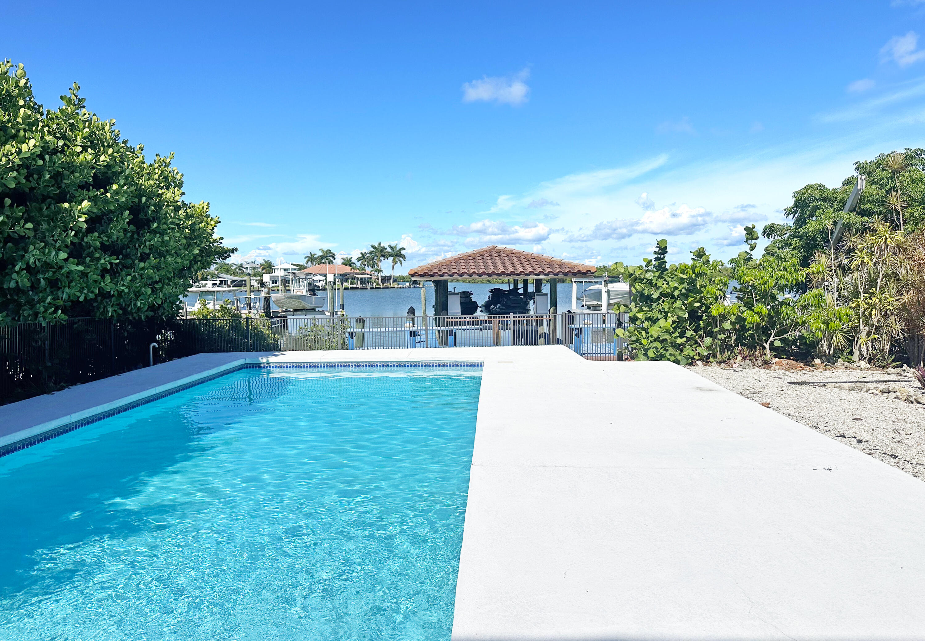 11 Capri Boulevard Naples, FL 34113 - Photo 23 of 39 a view of swimming pool with a yard