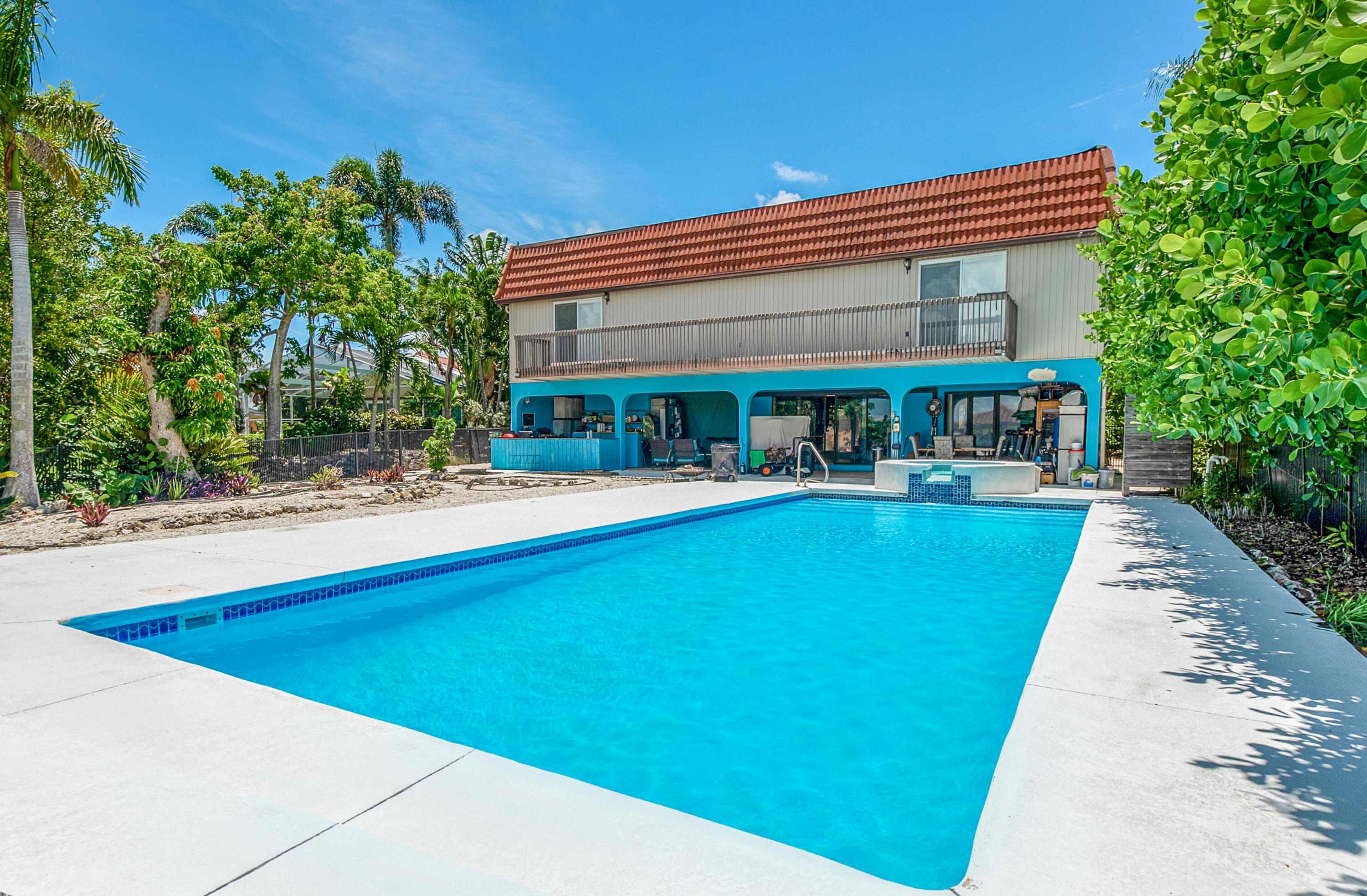 11 Capri Boulevard Naples, FL 34113 - Photo 26 of 39 a view of house with swimming pool and outdoor seating