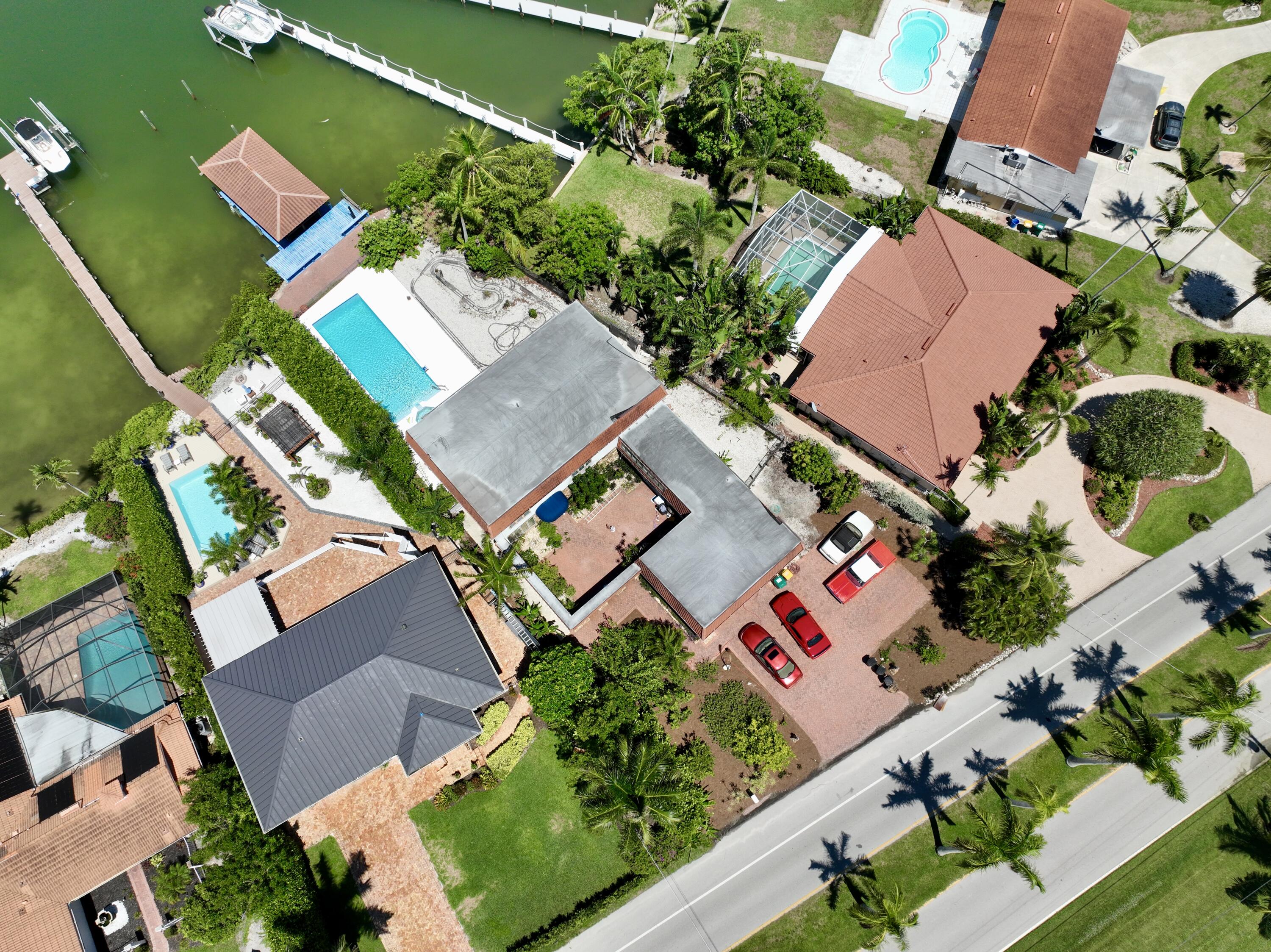 11 Capri Boulevard Naples, FL 34113 - Photo 27 of 39 an aerial view of a house with a garden