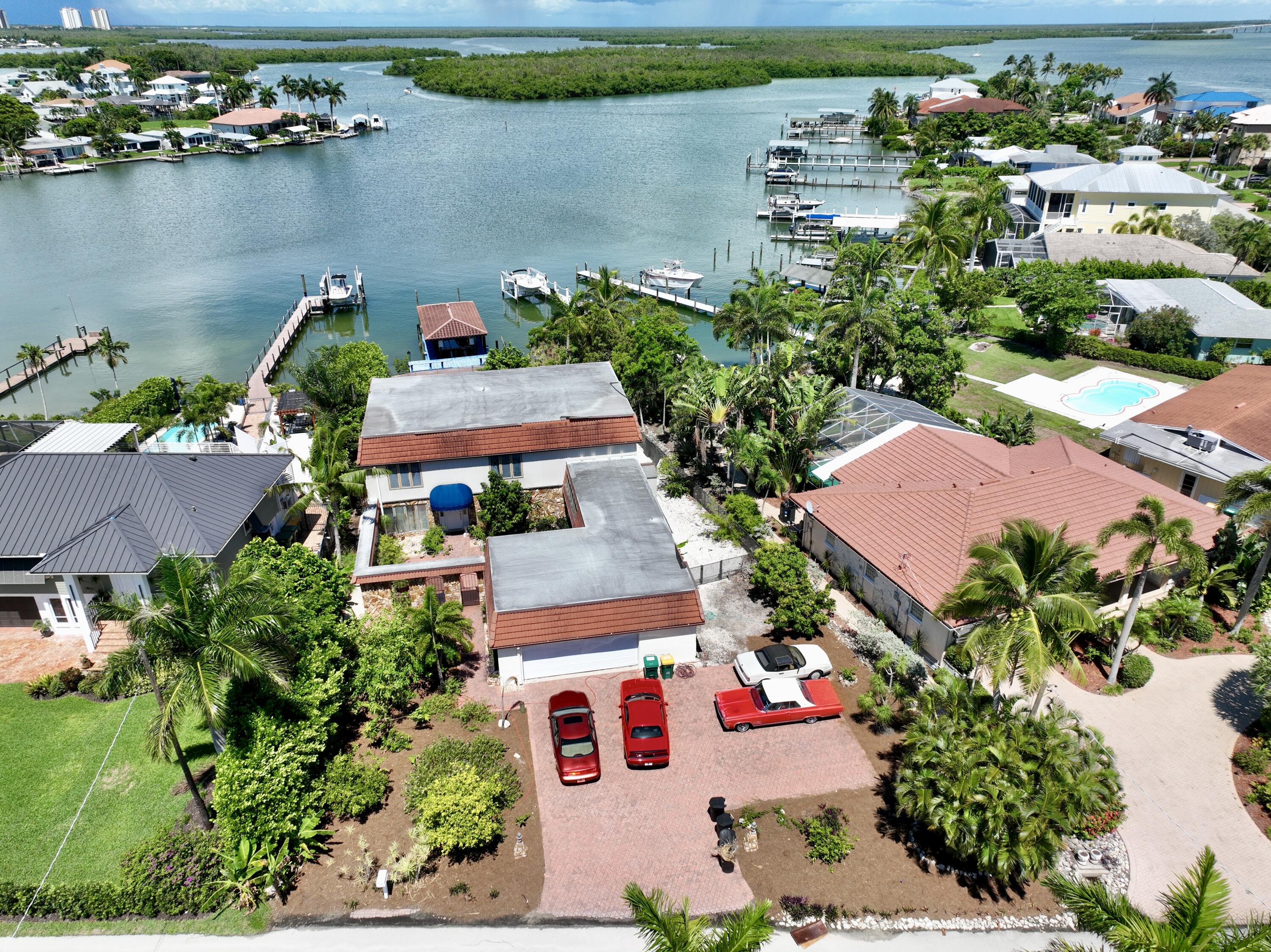11 Capri Boulevard Naples, FL 34113 - Photo 28 of 39 an aerial view of house with yard space and lake view