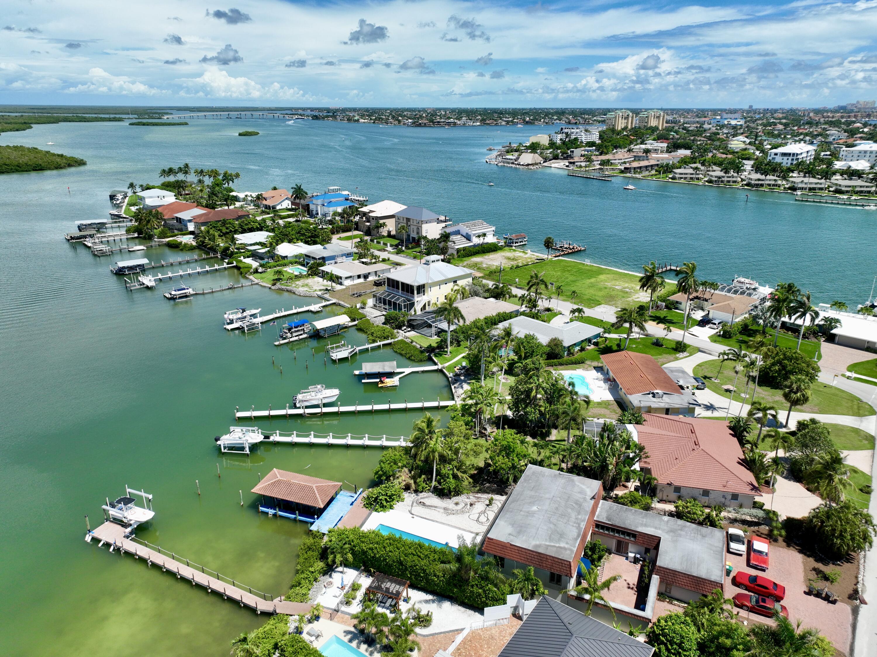 11 Capri Boulevard Naples, FL 34113 - Photo 29 of 39 an aerial view of a house with a lake view