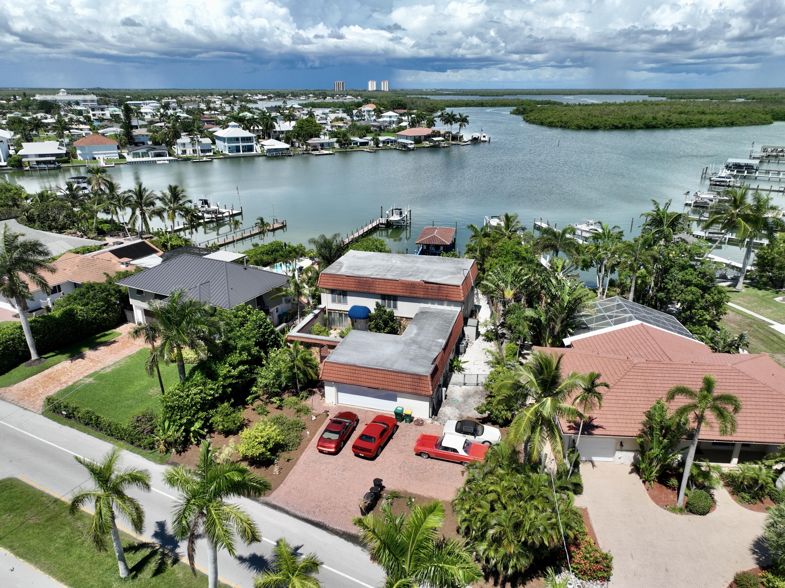 11 Capri Boulevard Naples, FL 34113 - Photo 31 of 39 an aerial view of residential house with outdoor space and lake view