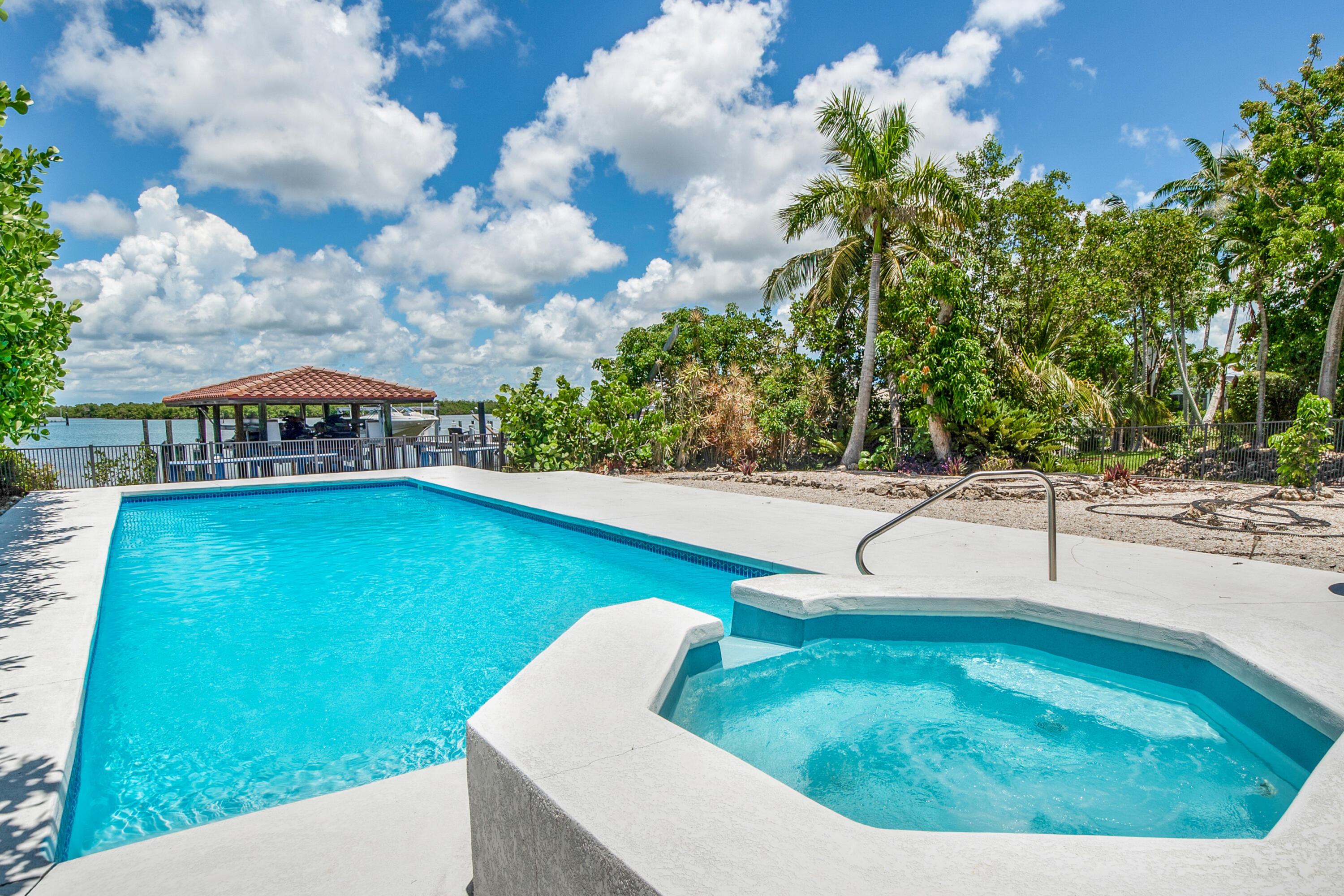 11 Capri Boulevard Naples, FL 34113 - Photo 6 of 39 a view of a swimming pool with a yard