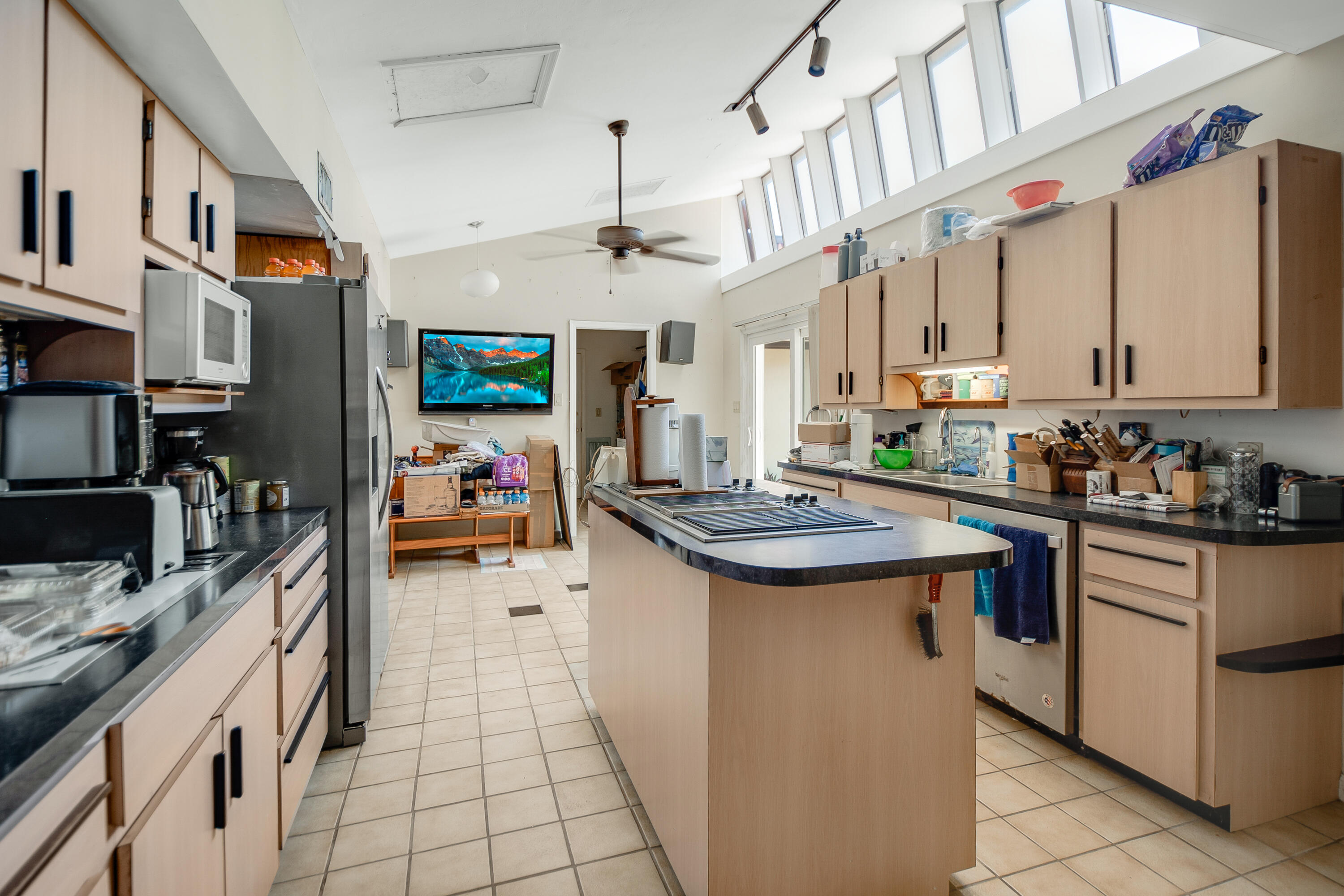 11 Capri Boulevard Naples, FL 34113 - Photo 9 of 39 a kitchen with stainless steel appliances granite countertop a sink and cabinets