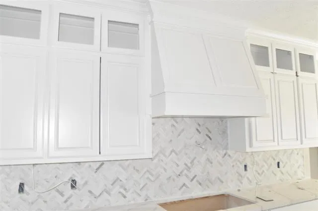 a view of a dining room and livingroom with furniture wooden floor a chandelier