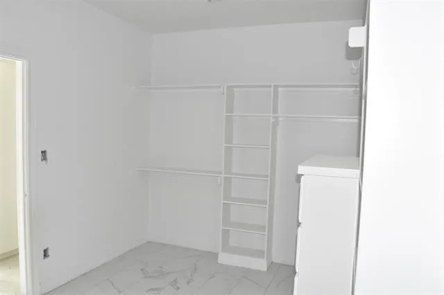 a view of a room with a hallway