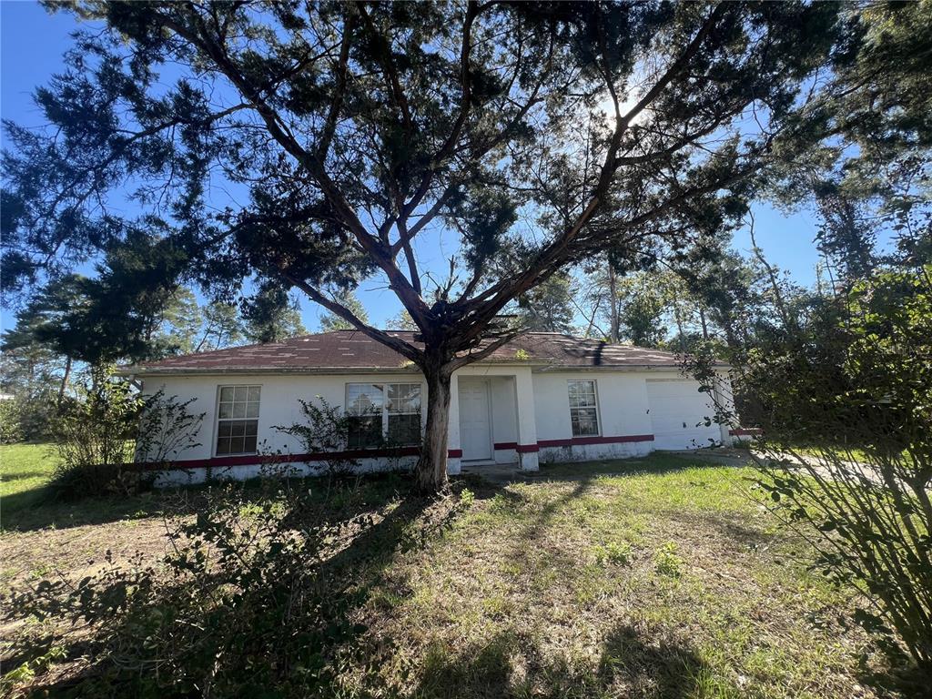 front view of a house with a yard