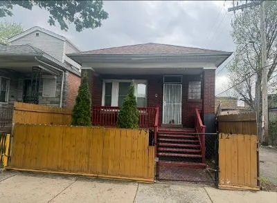 a view of a house with a iron gate