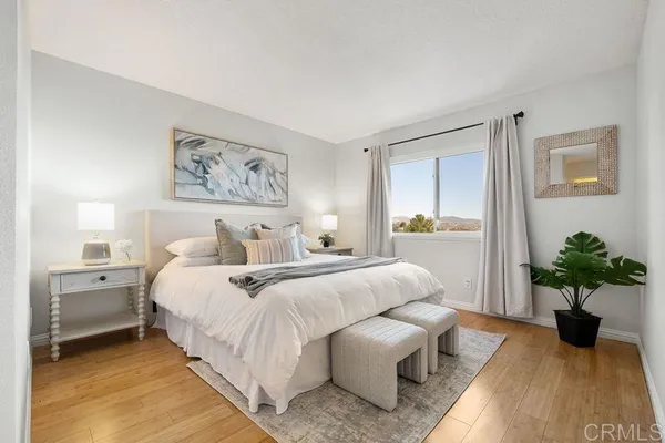 a bedroom with bed and a couch