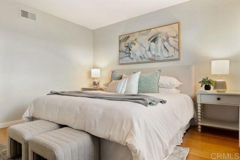 2118 Valleydale Lane Encinitas, CA 92024 - Photo 16 of 35 a bedroom with bed and painting on the wall