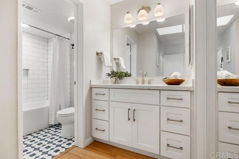 2118 Valleydale Lane Encinitas, CA 92024 - Photo 18 of 35 a bathroom with a sink a toilet and shower