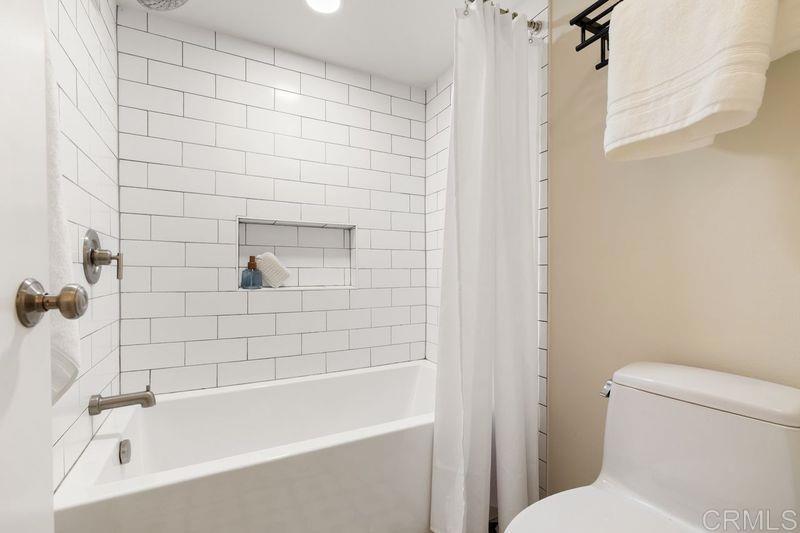 2118 Valleydale Lane Encinitas, CA 92024 - Photo 19 of 35 a white bath tub sitting next to a white toilet