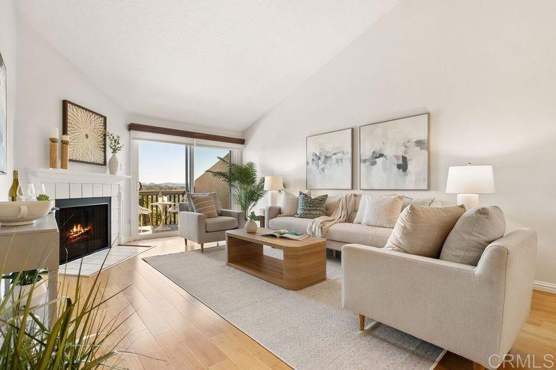 2118 Valleydale Lane Encinitas, CA 92024 - Photo 2 of 35 a living room with furniture a fireplace and a large window
