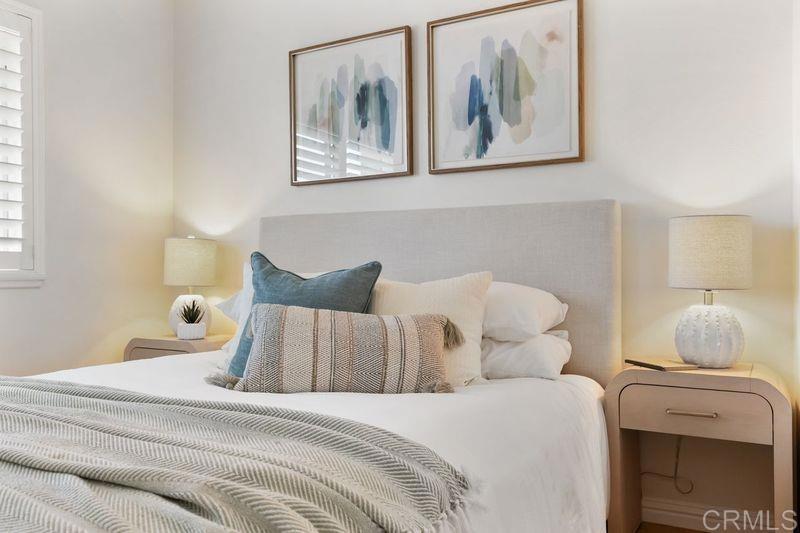 2118 Valleydale Lane Encinitas, CA 92024 - Photo 21 of 35 a bedroom with bed and wall painting