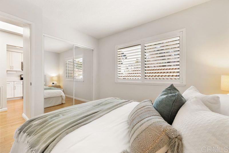 2118 Valleydale Lane Encinitas, CA 92024 - Photo 22 of 35 a bedroom with a large bed and a window