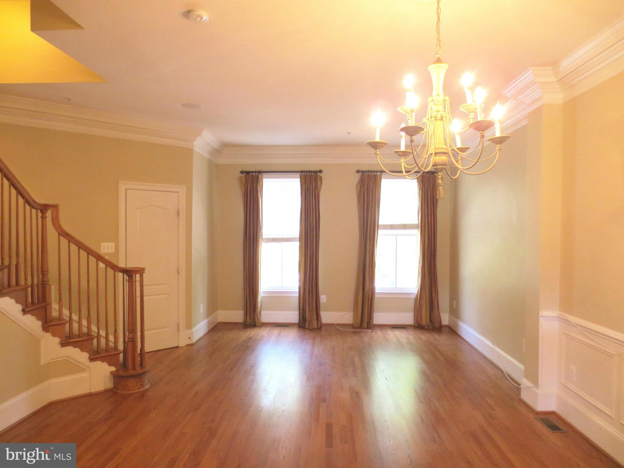 716 Carpenter Road Alexandria, VA 22314 - Photo 11 of 28 a view of a room with wooden floor and windows