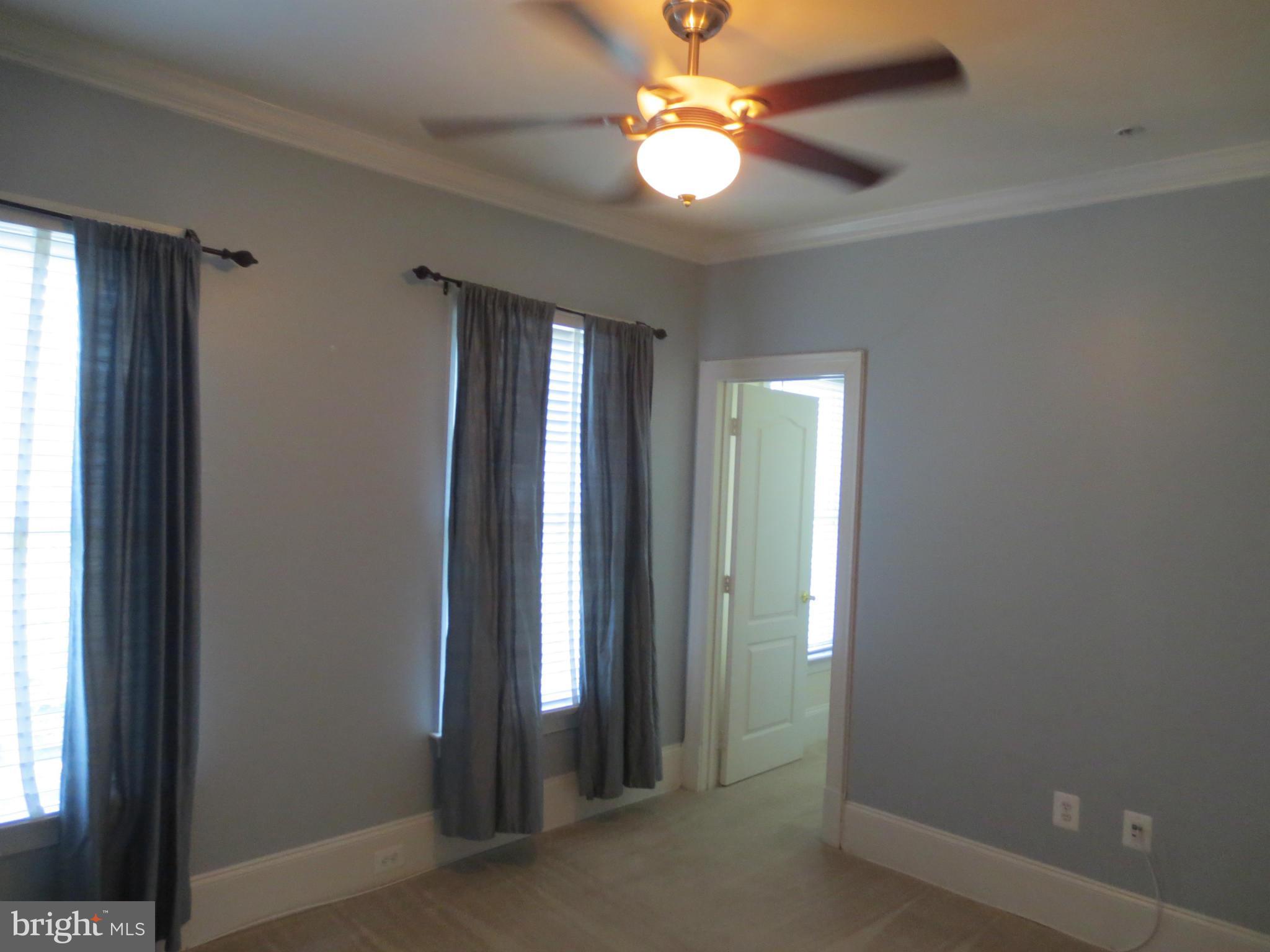 716 Carpenter Road Alexandria, VA 22314 - Photo 16 of 28 an empty room with closet and a chandelier fan