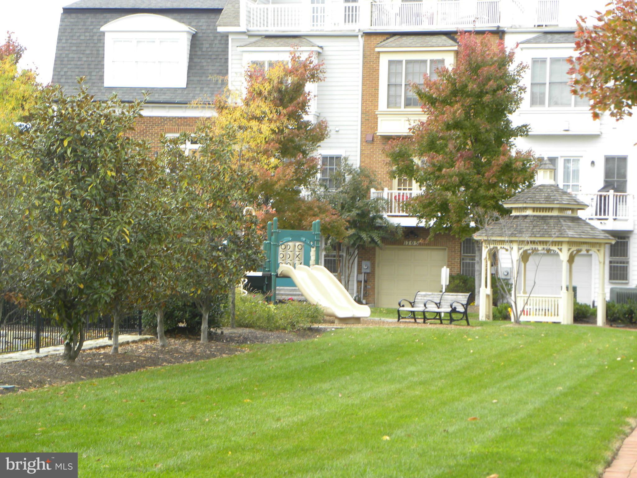 716 Carpenter Road Alexandria, VA 22314 - Photo 20 of 28 a front view of a building with a yard