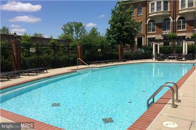 716 Carpenter Road Alexandria, VA 22314 - Photo 24 of 28 a view of a swimming pool with a patio