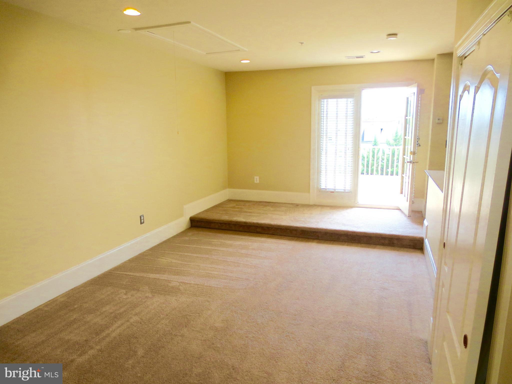 716 Carpenter Road Alexandria, VA 22314 - Photo 5 of 28 a view of an empty room with a window