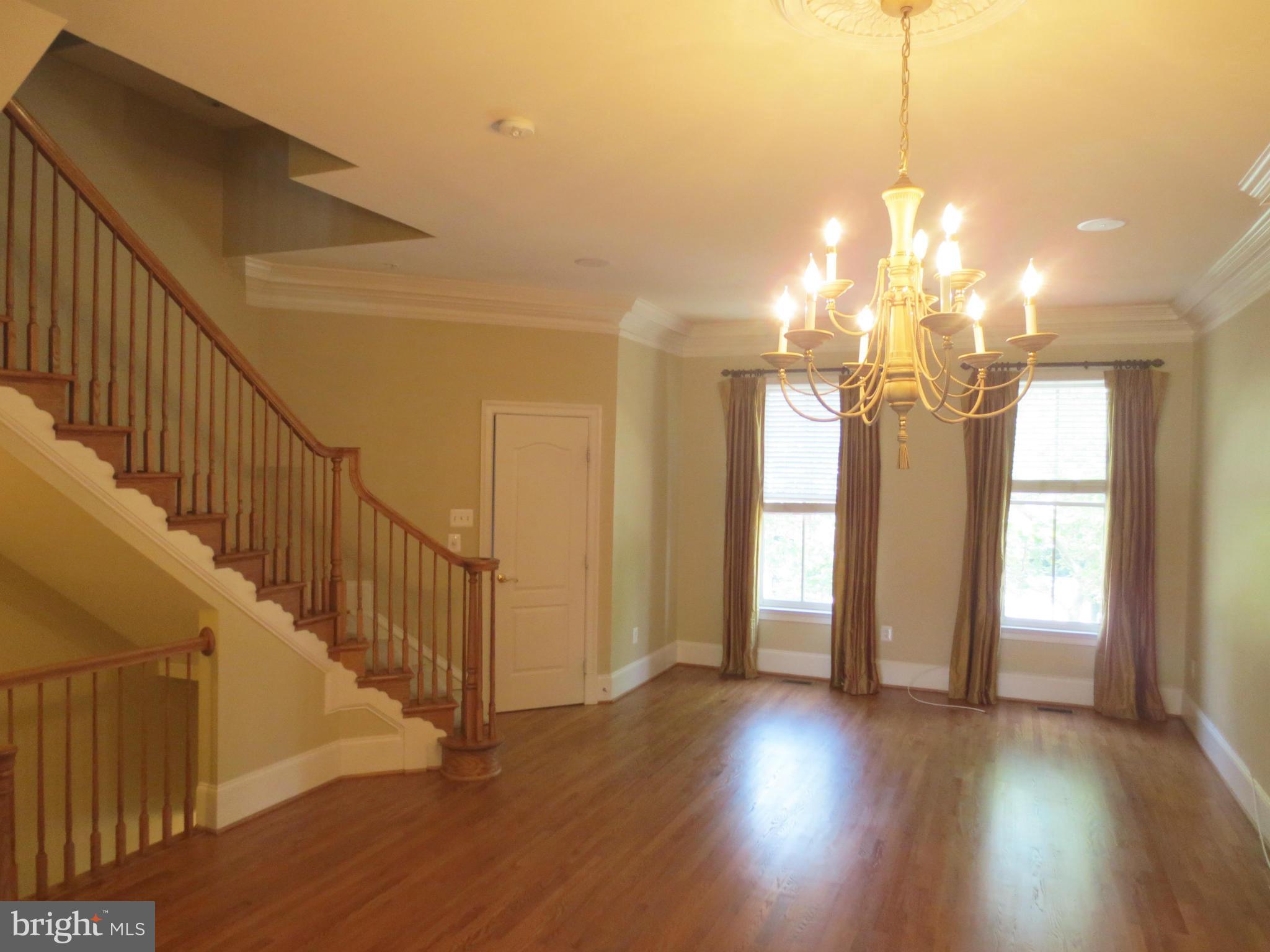 716 Carpenter Road Alexandria, VA 22314 - Photo 7 of 28 a view of a room with wooden floor and windows