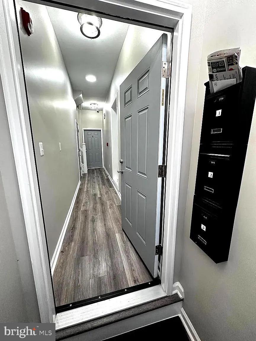 1721 McCulloh Street, Unit 3 Baltimore, MD 21217 - Photo 10 of 11 a view of a hallway with wooden floor