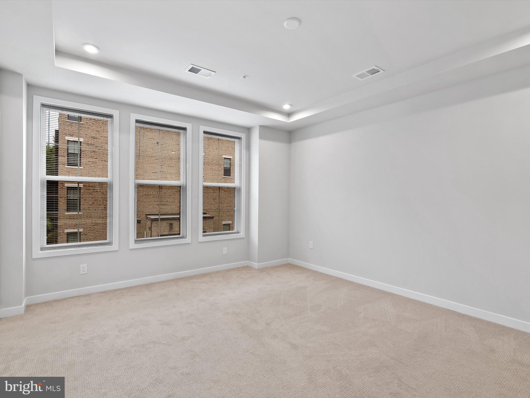 7465 Backett Wood Terrace, Unit 1215 McLean, VA 22102 - Photo 11 of 23 an empty room with a window