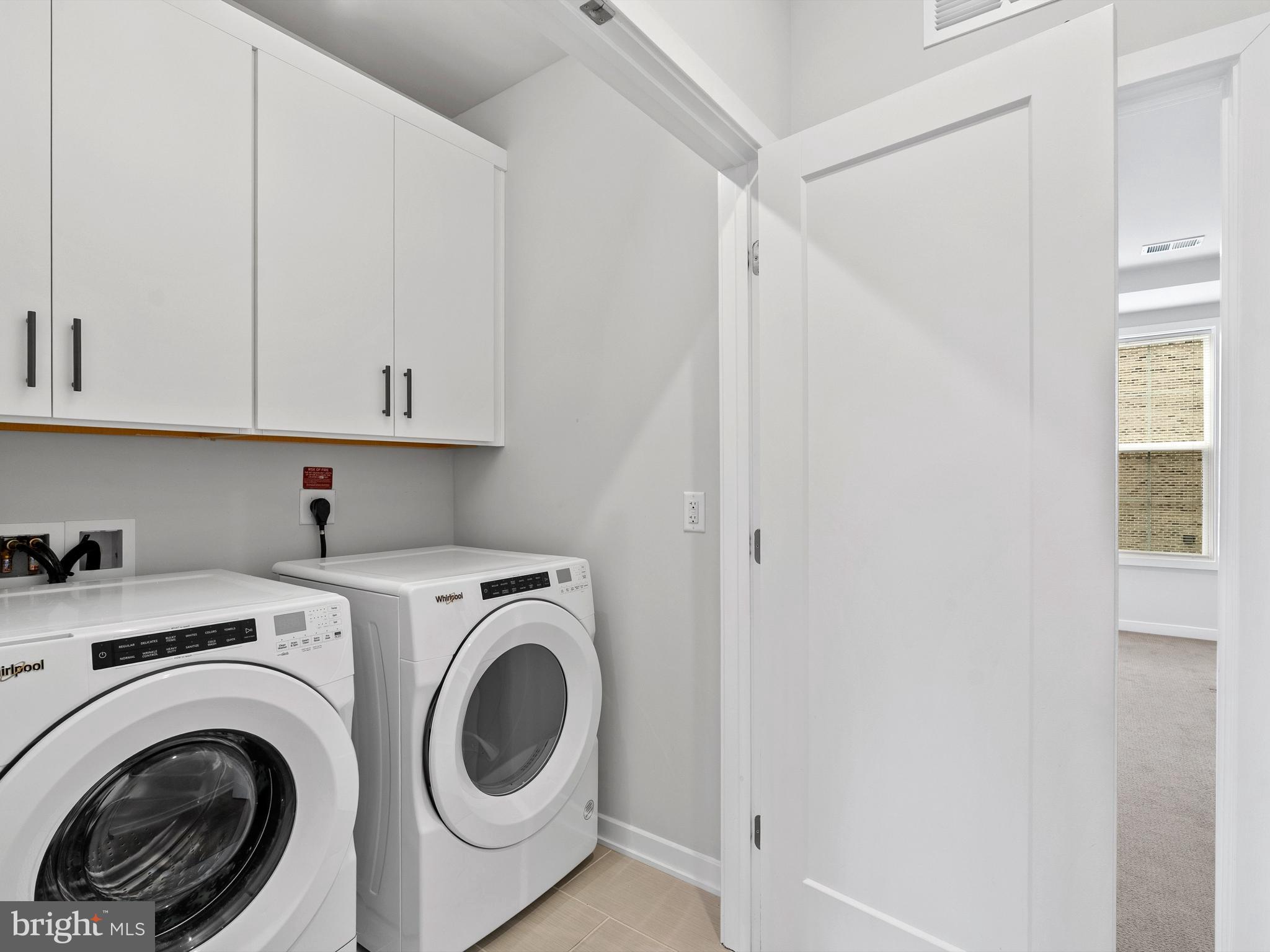 7465 Backett Wood Terrace, Unit 1215 McLean, VA 22102 - Photo 14 of 23 a utility room with dryer and washer