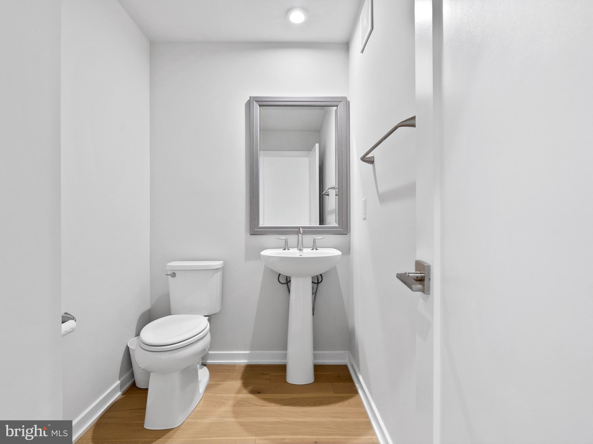 7465 Backett Wood Terrace, Unit 1215 McLean, VA 22102 - Photo 15 of 23 a bathroom with a toilet and a sink