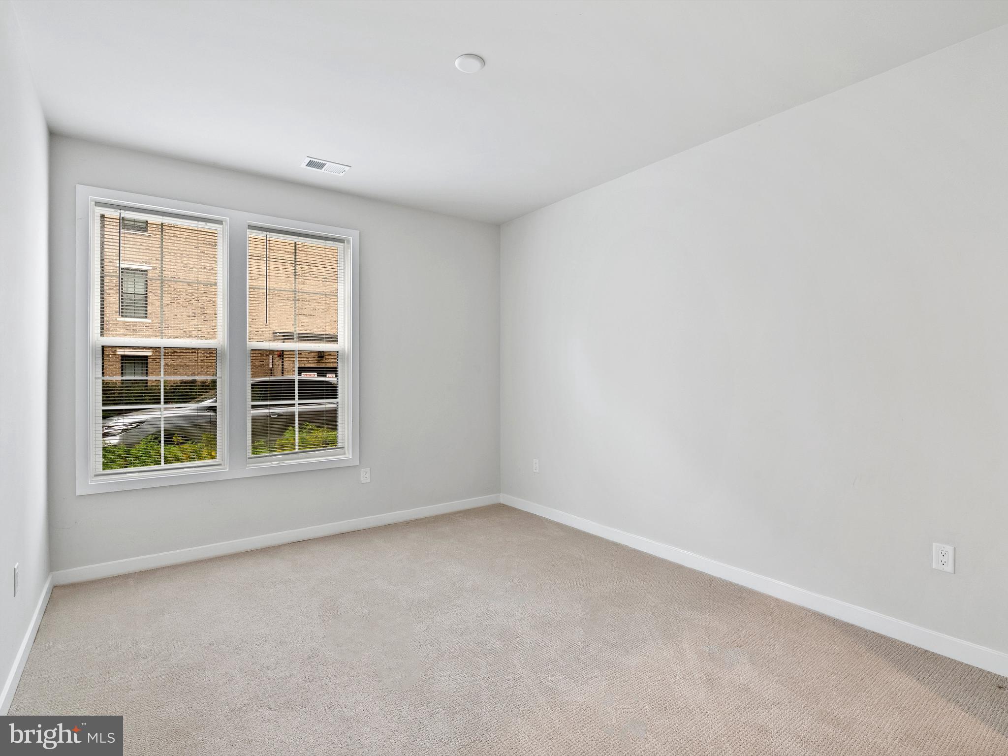 7465 Backett Wood Terrace, Unit 1215 McLean, VA 22102 - Photo 17 of 23 an empty room with a window
