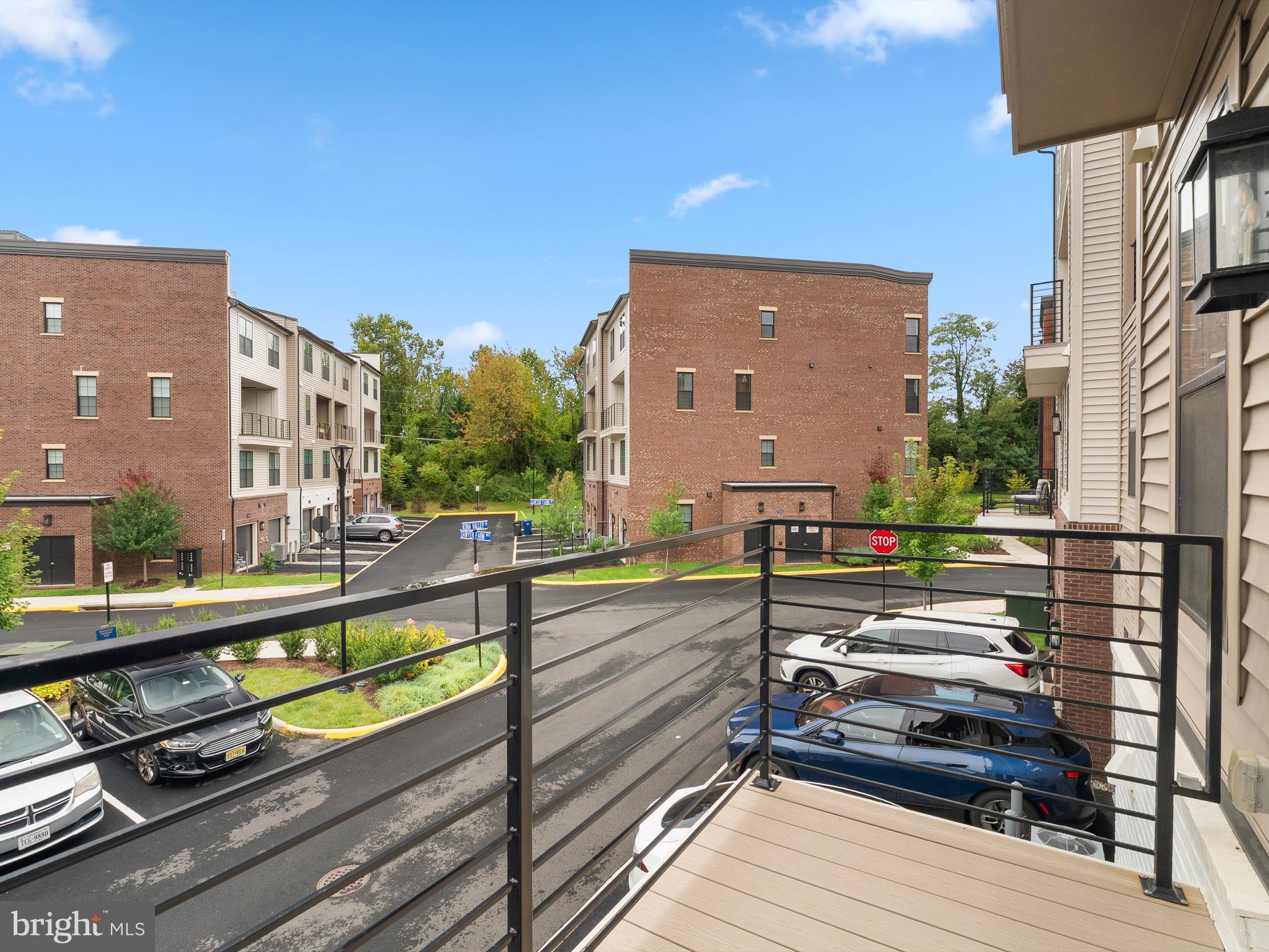 7465 Backett Wood Terrace, Unit 1215 McLean, VA 22102 - Photo 20 of 23 a view of a balcony with chairs