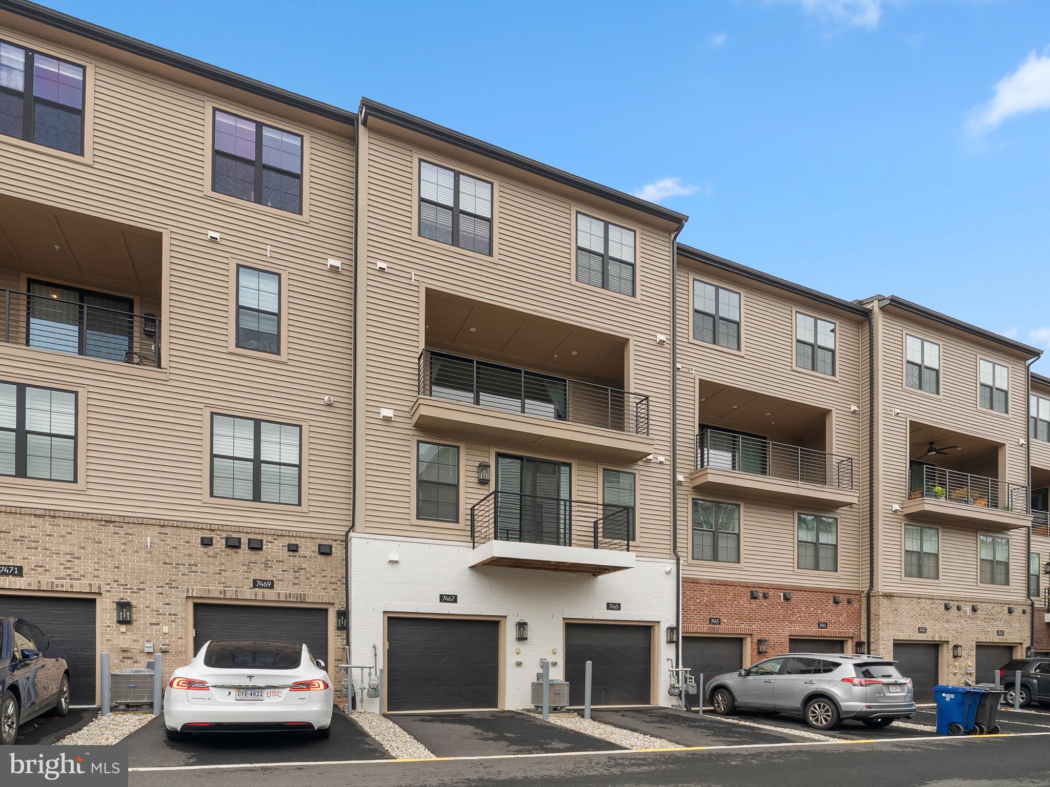 7465 Backett Wood Terrace, Unit 1215 McLean, VA 22102 - Photo 21 of 23 a car parked in front of a building