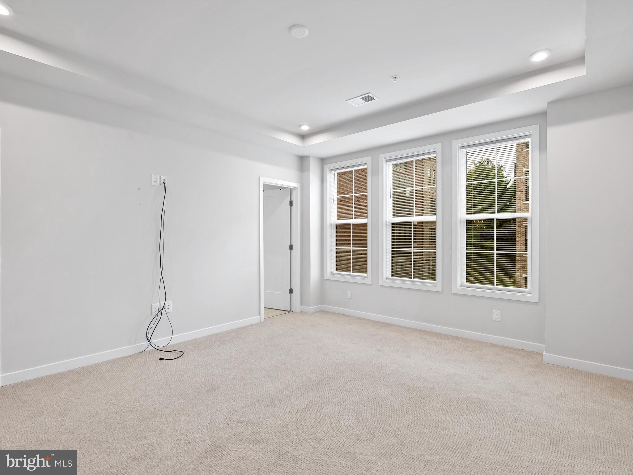 7465 Backett Wood Terrace, Unit 1215 McLean, VA 22102 - Photo 10 of 23 a view of an empty room with a window