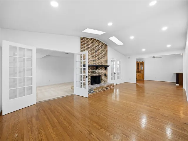 a view of an empty room with a fireplace
