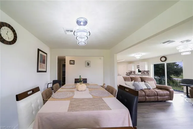 a bedroom with furniture and a large mirror