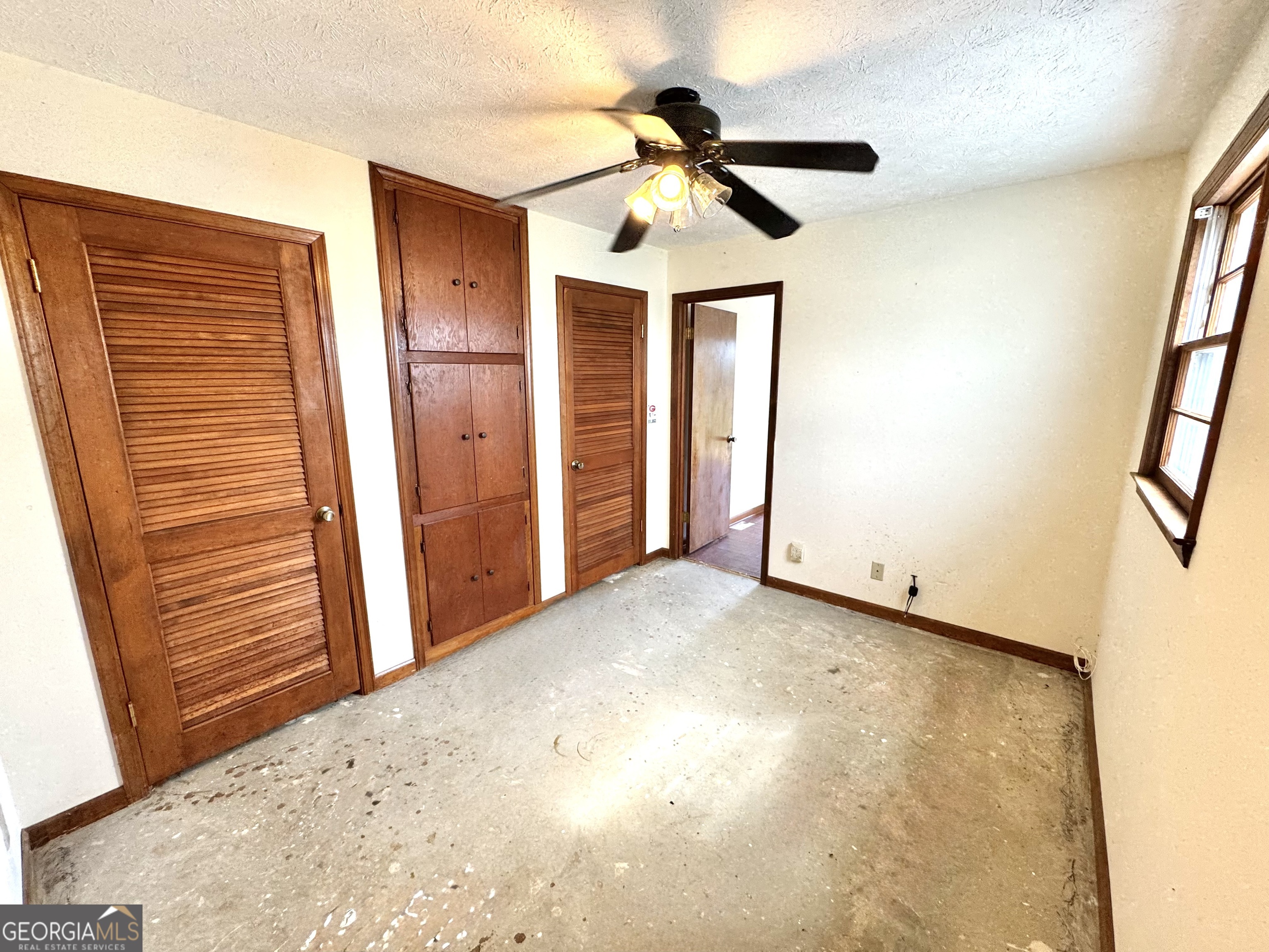 1760 Fears Road Rutledge, GA 30663 - Photo 33 of 68 a view of a livingroom with a ceiling fan and window