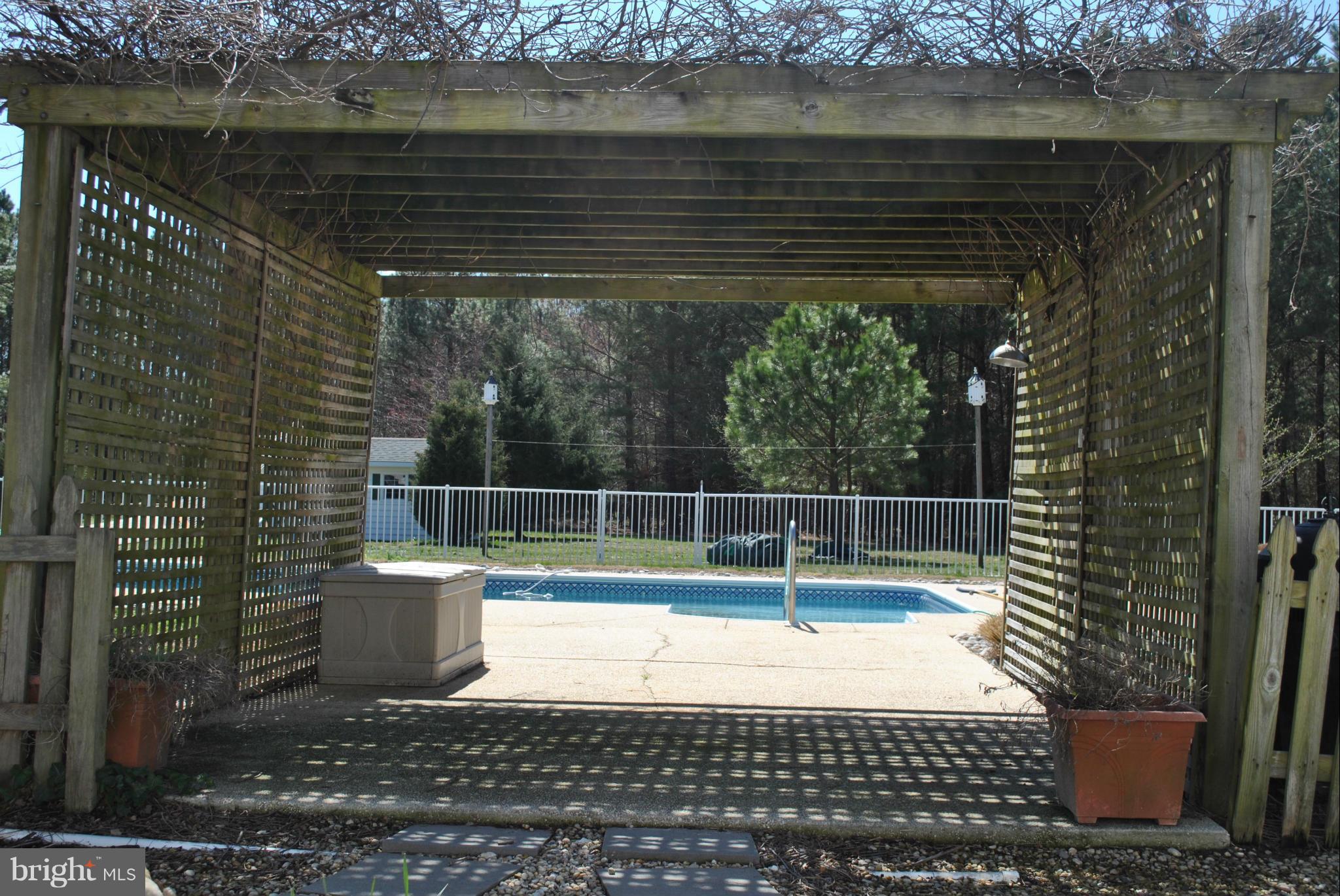 23965 Mt Misery Road St. Michaels, MD 21663 - Photo 7 of 26 pergola leading to pool