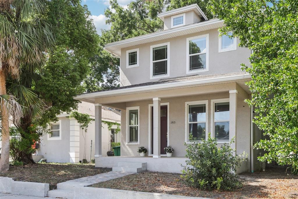 1913 West Pine Street Tampa, FL 33607 - Photo 1 of 1 a front view of a house with a yard