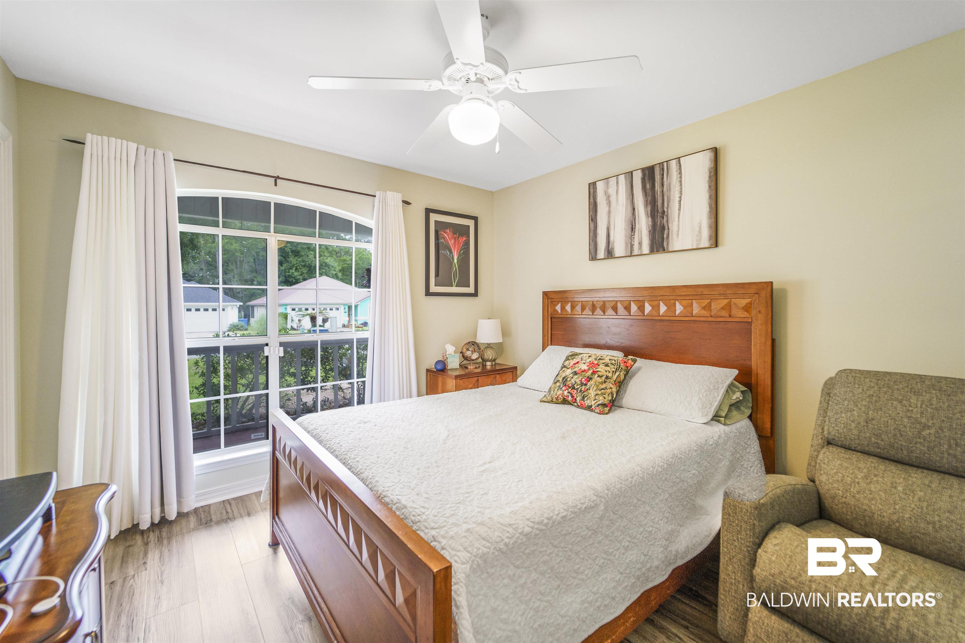 4620 Pine Boulevard Orange Beach, AL 36561 - Photo 20 of 49 Bedroom featuring wood finished floors and ceiling fan