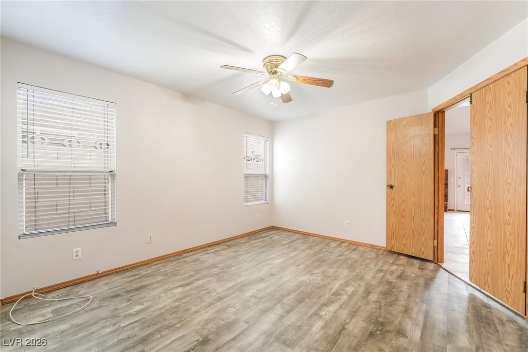 516 Inness Avenue Henderson, NV 89011 - Photo 24 of 42 Empty room featuring light wood-type flooring and a ceiling fan