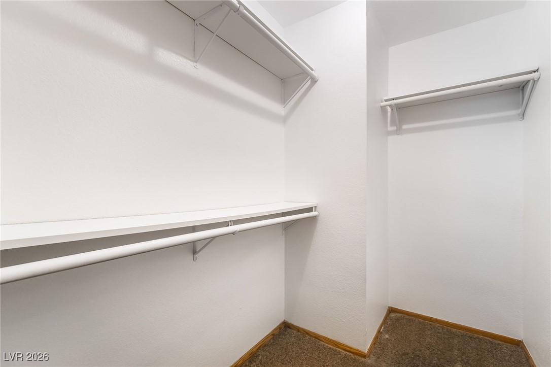 516 Inness Avenue Henderson, NV 89011 - Photo 27 of 42 Walk in closet featuring dark carpet