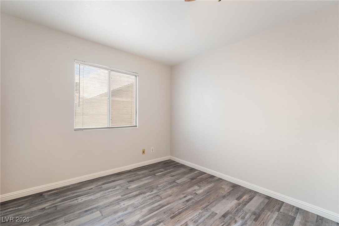 516 Inness Avenue Henderson, NV 89011 - Photo 28 of 42 Empty room featuring wood finished floors and baseboards