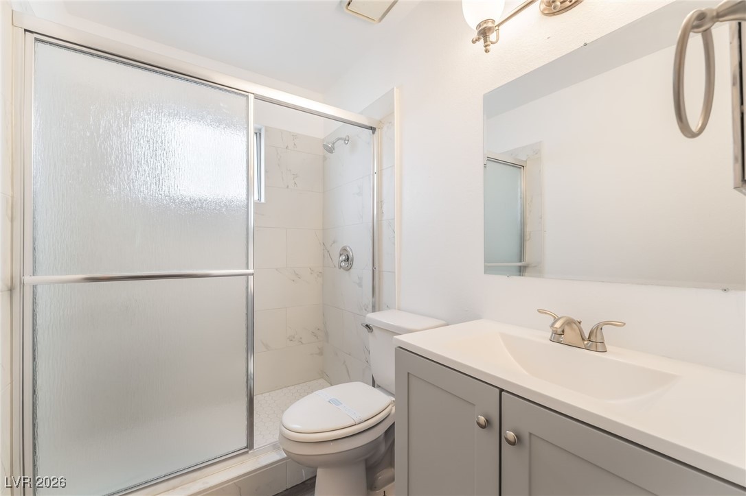 516 Inness Avenue Henderson, NV 89011 - Photo 30 of 42 Full bathroom with vanity and a stall shower