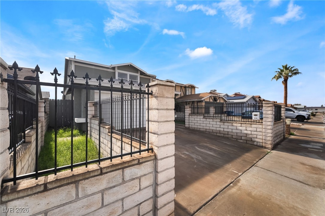 516 Inness Avenue Henderson, NV 89011 - Photo 3 of 42 Gate with a fenced front yard and a residential view