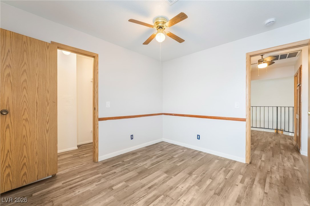 516 Inness Avenue Henderson, NV 89011 - Photo 31 of 42 Unfurnished room with ceiling fan and wood finished floors