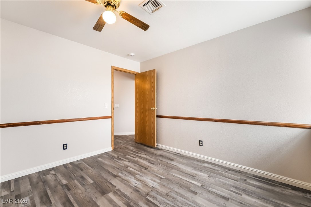 516 Inness Avenue Henderson, NV 89011 - Photo 32 of 42 Spare room with wood finished floors and a ceiling fan