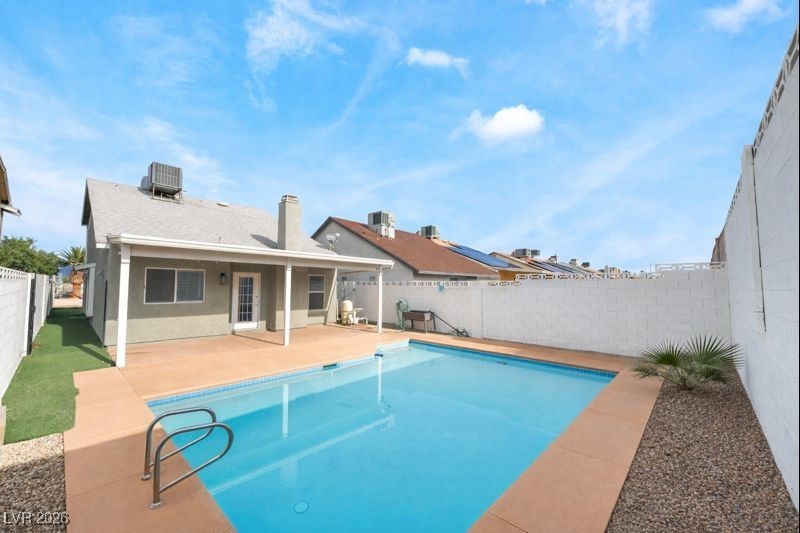 516 Inness Avenue Henderson, NV 89011 - Photo 38 of 42 View of swimming pool with a patio and a fenced backyard
