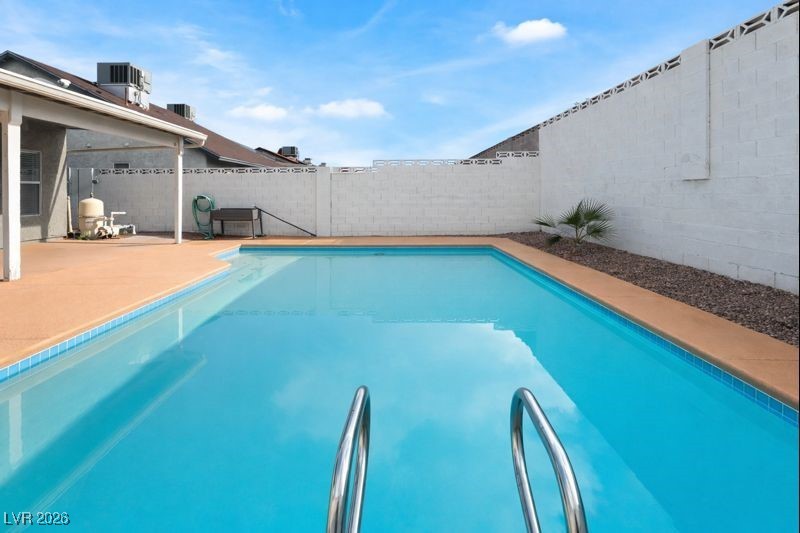 516 Inness Avenue Henderson, NV 89011 - Photo 39 of 42 View of swimming pool featuring a fenced backyard and a patio