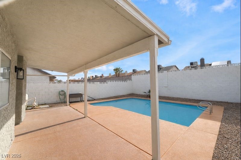 516 Inness Avenue Henderson, NV 89011 - Photo 40 of 42 View of pool with a patio area and a fenced backyard