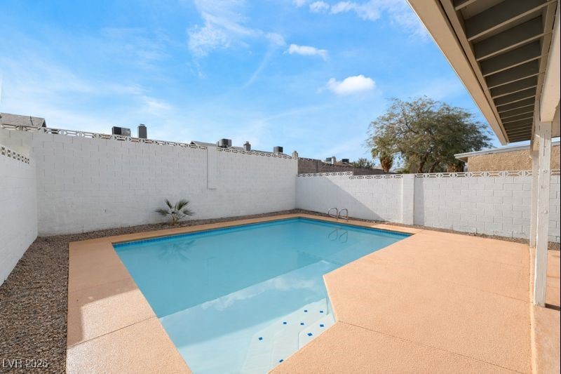 516 Inness Avenue Henderson, NV 89011 - Photo 41 of 42 View of swimming pool with a patio and a fenced backyard